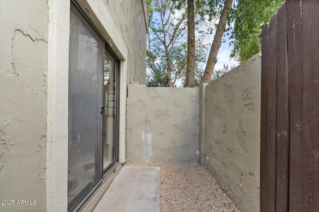 view of patio featuring fence