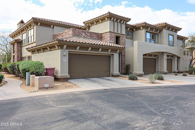 19700 N 76th St Unit 1124, Scottsdale, AZ 85255 - mediterranean / spanish-style home with a tile roof, driveway, and stucco siding