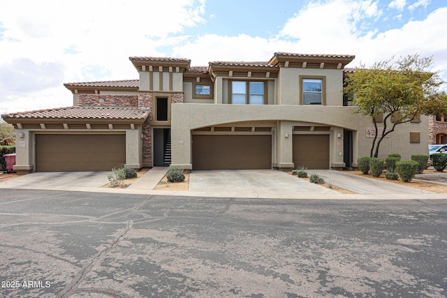 19700 N 76th St Unit 1124, Scottsdale, AZ 85255 - view of front facade featuring driveway, stucco siding, and a tiled roof