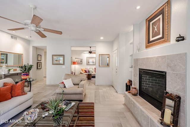 19700 N 76th St Unit 1124, Scottsdale, AZ 85255 - living area with visible vents, a tiled fireplace, recessed lighting, and a ceiling fan