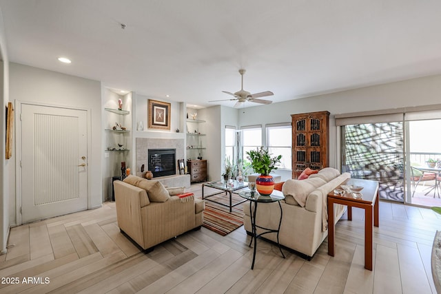 19700 N 76th St Unit 1124, Scottsdale, AZ 85255 - living area with light wood-type flooring, a tiled fireplace, ceiling fan, and recessed lighting