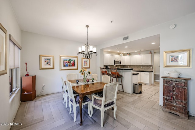 19700 N 76th St Unit 1124, Scottsdale, AZ 85255 - dining space with an inviting chandelier, recessed lighting, and visible vents