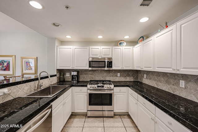 19700 N 76th St Unit 1124, Scottsdale, AZ 85255 - kitchen with white cabinetry, a sink, light tile patterned floors, and appliances with stainless steel finishes