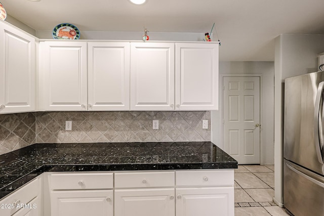 19700 N 76th St Unit 1124, Scottsdale, AZ 85255 - kitchen with backsplash, freestanding refrigerator, white cabinetry, light tile patterned floors, and tile countertops