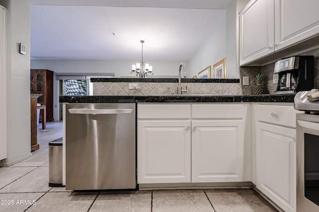 19700 N 76th St Unit 1124, Scottsdale, AZ 85255 - kitchen featuring white cabinetry, dark countertops, backsplash, and appliances with stainless steel finishes