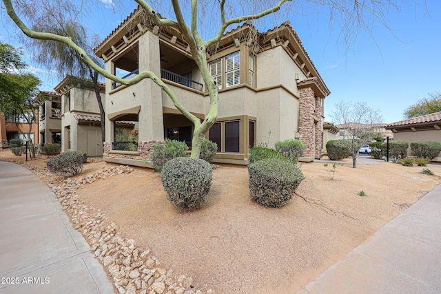 19700 N 76th St Unit 1124, Scottsdale, AZ 85255 - view of front of property with a balcony and stucco siding