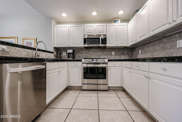 19700 N 76th St Unit 1124, Scottsdale, AZ 85255 - kitchen with white cabinets, a sink, and stainless steel appliances