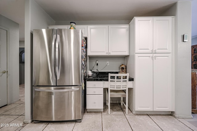 19700 N 76th St Unit 1124, Scottsdale, AZ 85255 - kitchen with freestanding refrigerator, dark countertops, white cabinetry, and light tile patterned floors