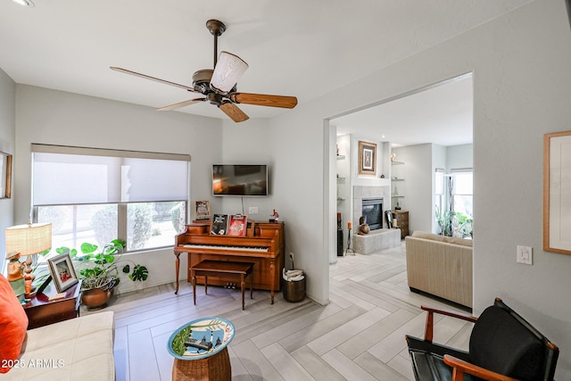 19700 N 76th St Unit 1124, Scottsdale, AZ 85255 - living room with a wealth of natural light, a fireplace, and ceiling fan