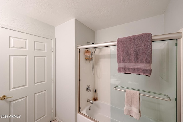 19700 N 76th St Unit 1124, Scottsdale, AZ 85255 - full bathroom featuring bath / shower combo with glass door and a textured ceiling