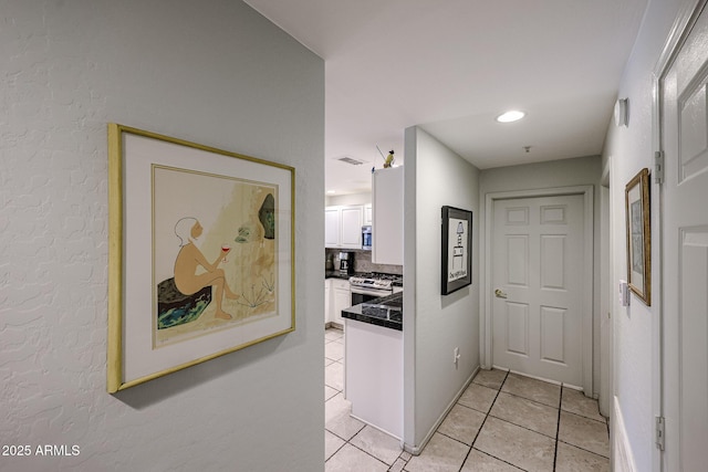 19700 N 76th St Unit 1124, Scottsdale, AZ 85255 - hallway featuring light tile patterned flooring, baseboards, and visible vents