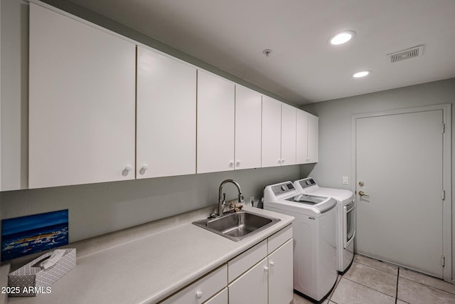 19700 N 76th St Unit 1124, Scottsdale, AZ 85255 - washroom with light tile patterned flooring, a sink, visible vents, washer and dryer, and cabinet space