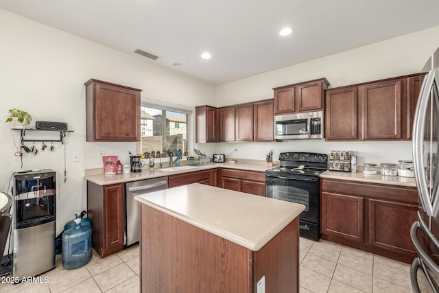 kitchen with stainless steel appliances, light tile patterned flooring, a center island, and sink