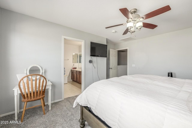 carpeted bedroom featuring ceiling fan and ensuite bathroom