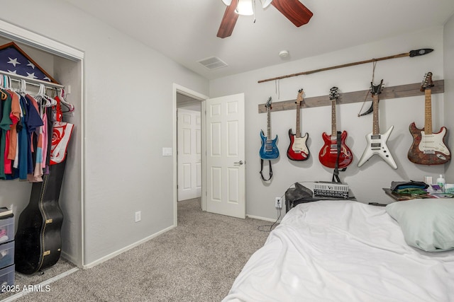 carpeted bedroom with ceiling fan and a closet