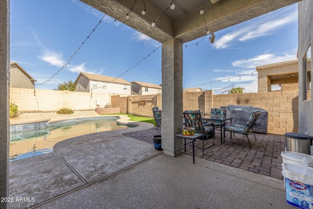 view of patio / terrace featuring a fenced in pool