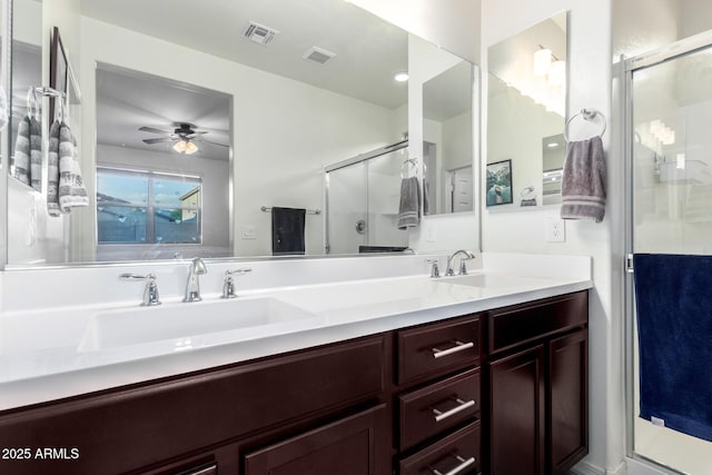 full bath with a stall shower, a sink, and visible vents