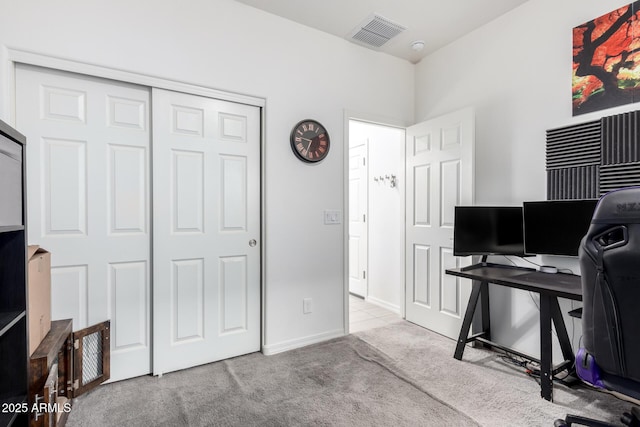 carpeted home office featuring visible vents and baseboards