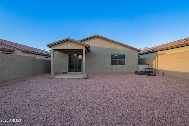 back of property featuring a patio area, a fenced backyard, and stucco siding