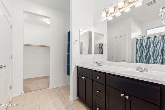 bathroom with vanity and tile patterned floors