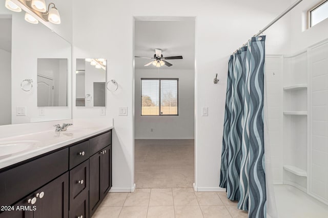 bathroom featuring tile patterned floors, ceiling fan, a shower with curtain, and vanity