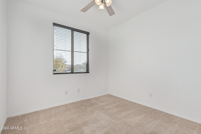 carpeted empty room with ceiling fan