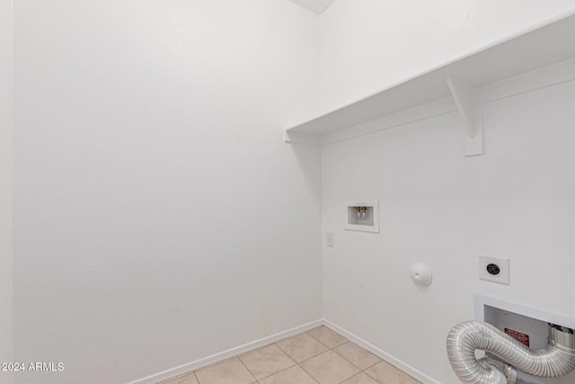 laundry room with hookup for an electric dryer, hookup for a washing machine, light tile patterned floors, and gas dryer hookup