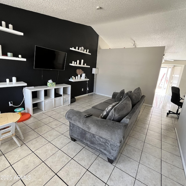 living area featuring light tile patterned flooring, a textured ceiling, and lofted ceiling