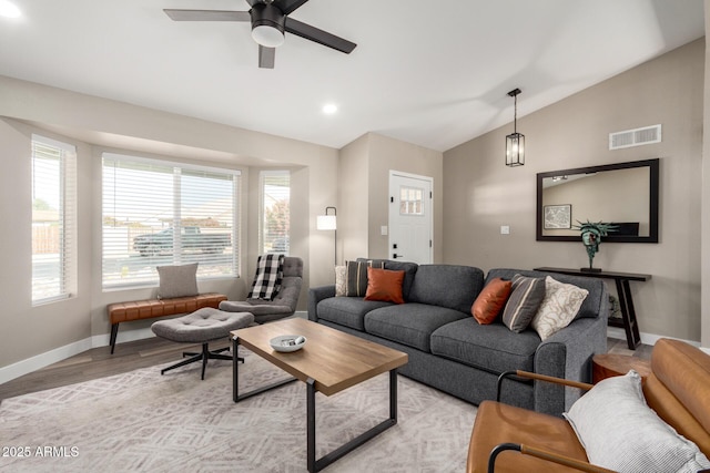 living room with vaulted ceiling, ceiling fan, and light hardwood / wood-style floors