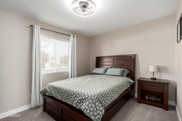 bedroom with light colored carpet