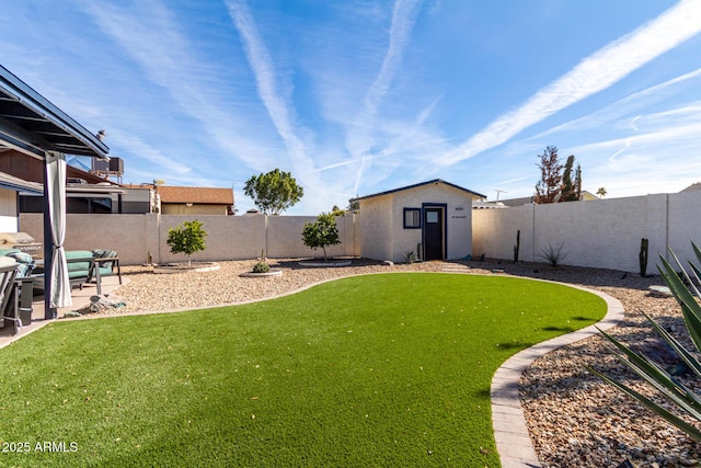 view of yard with an outbuilding and a patio