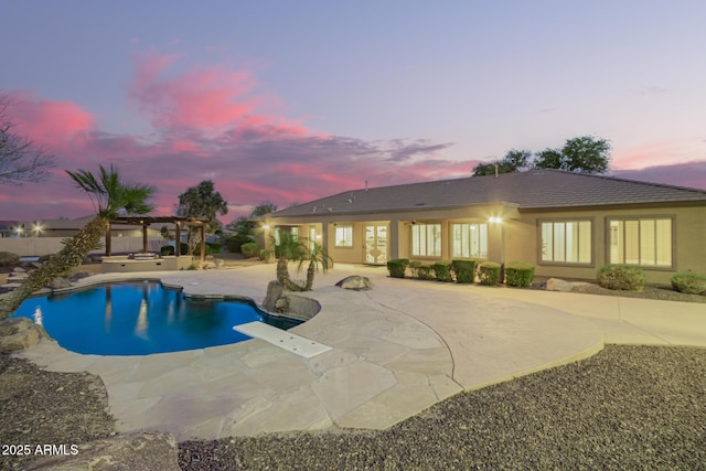 pool at dusk with a patio area, an outdoor pool, and a pergola