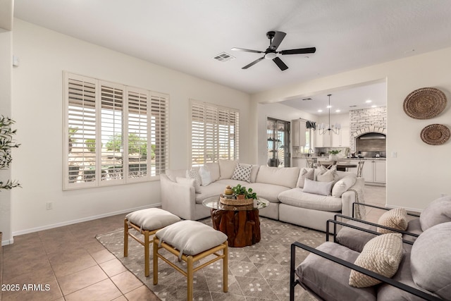living area with visible vents, baseboards, light tile patterned floors, ceiling fan, and recessed lighting