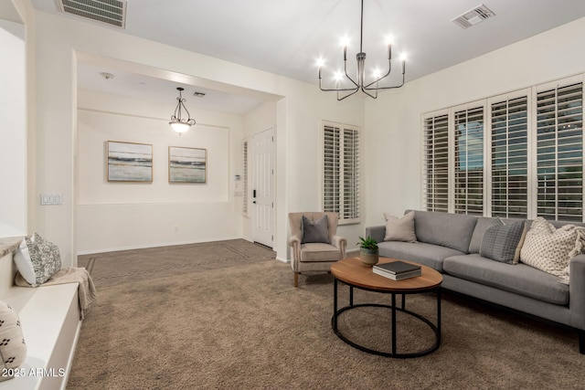 carpeted living area with an inviting chandelier and visible vents