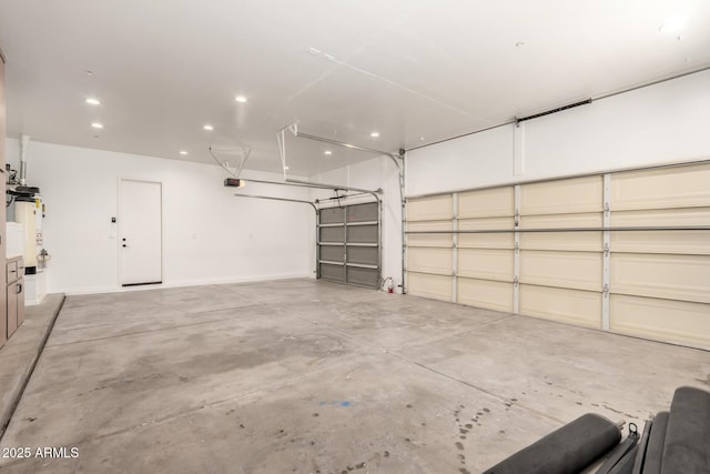 garage featuring a garage door opener, gas water heater, and recessed lighting