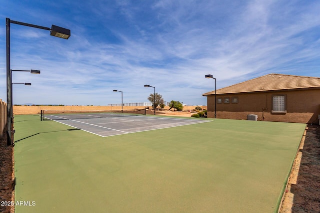 view of sport court featuring community basketball court and fence