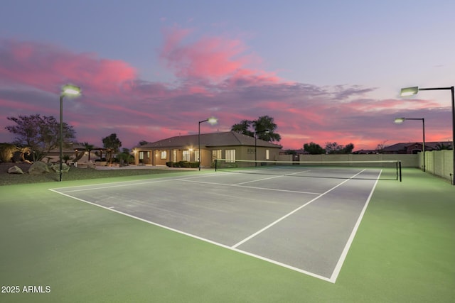 view of tennis court with fence