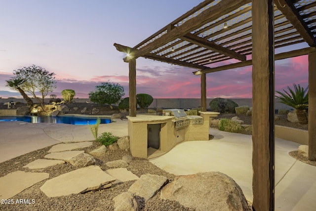 view of patio / terrace with a pergola, a grill, an outdoor kitchen, and a fenced in pool