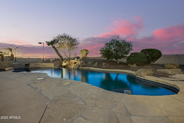 view of pool featuring a patio area, a fenced in pool, and fence