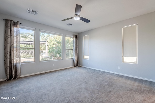 carpeted empty room featuring ceiling fan