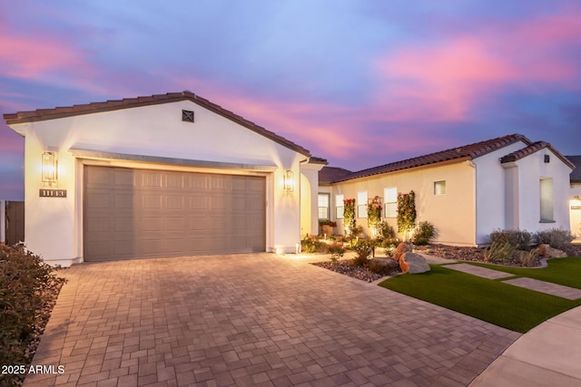 mediterranean / spanish house featuring a garage