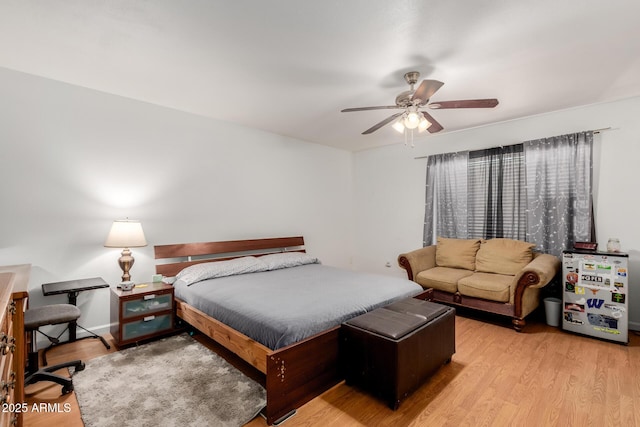 bedroom with ceiling fan and wood finished floors