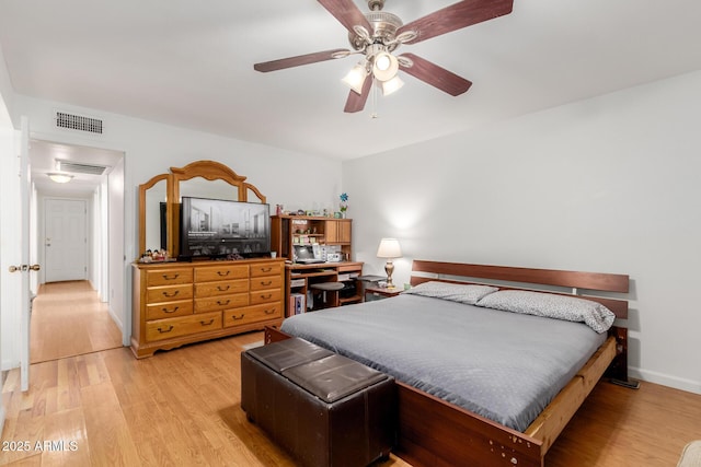 bedroom featuring baseboards, a ceiling fan, light wood-type flooring, and visible vents