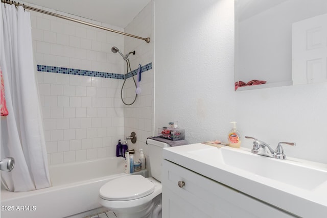 full bath featuring vanity, toilet, and shower / tub combo