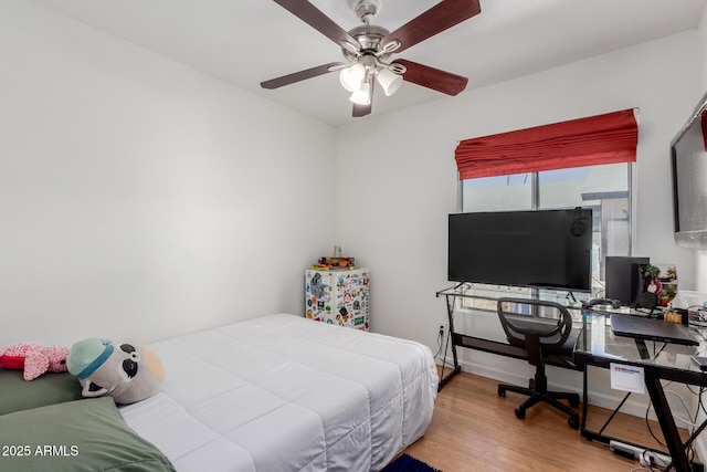 bedroom featuring ceiling fan and wood finished floors