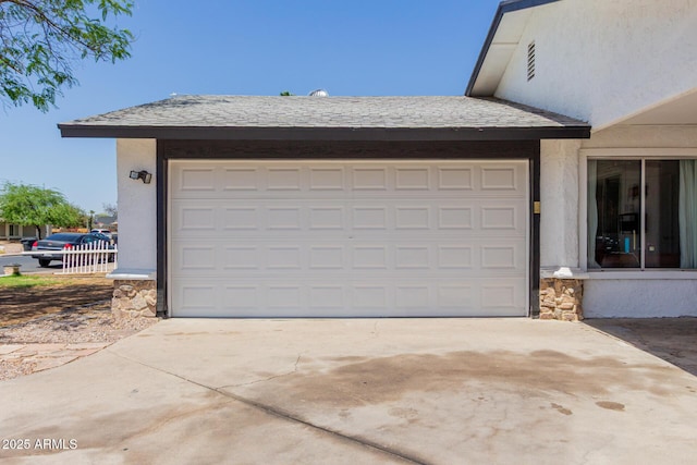 garage featuring driveway