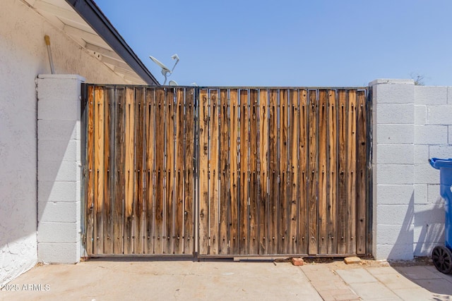 view of gate with fence