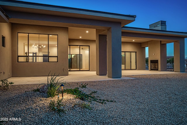 view of exterior entry featuring a patio