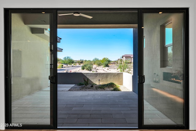 doorway to outside with ceiling fan and a wealth of natural light