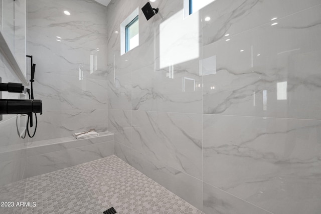 bathroom with a tile shower